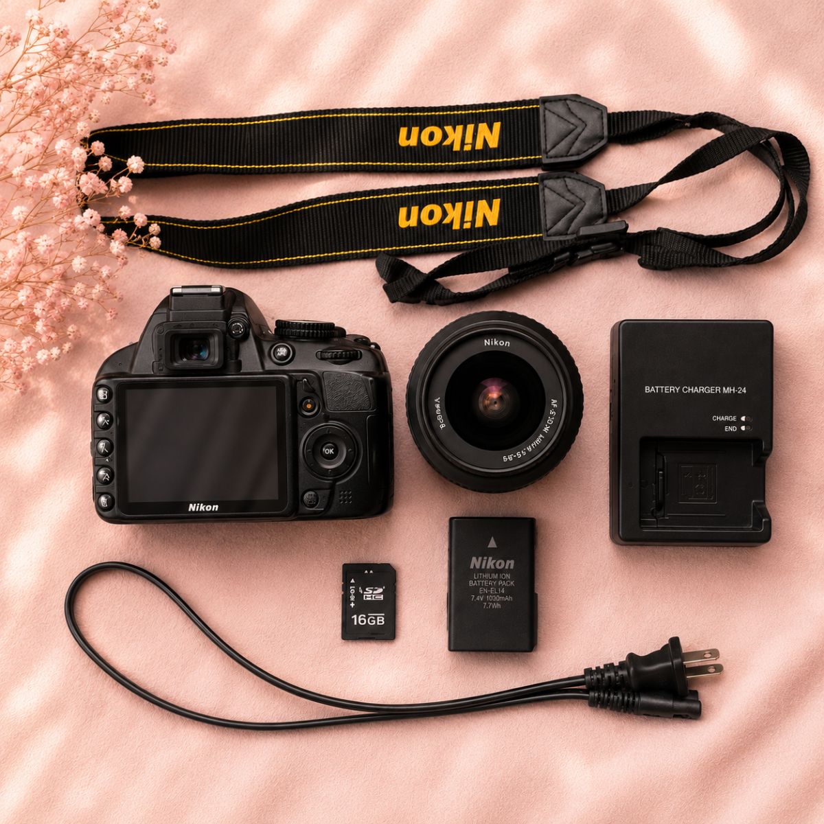 Nikon D3100 kit and inclusions flat lay